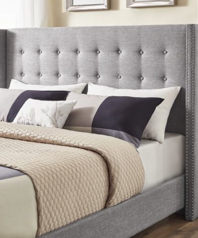 grey tufted bed